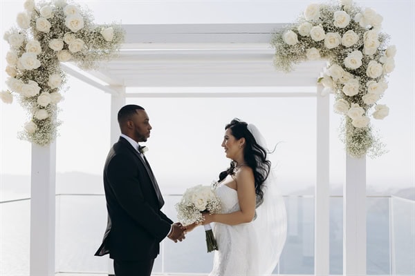 A dreamy fall wedding overlooking the caldera in beautiful Santorini | Salam & Armstrong