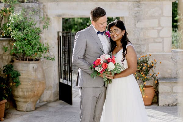 Summer wedding with bougainvillea blooms on the island of Crete | Luanshia & Stefan